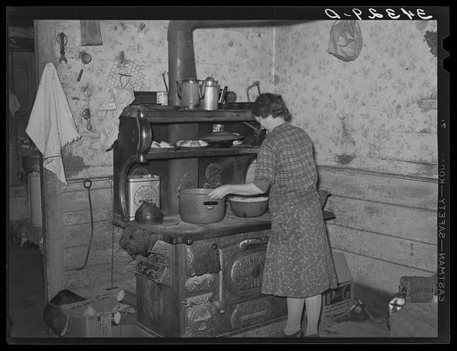 Preparing dinner in farm home of FSA (Farm Security Administration) client near Bradford, Vermont. Orange County