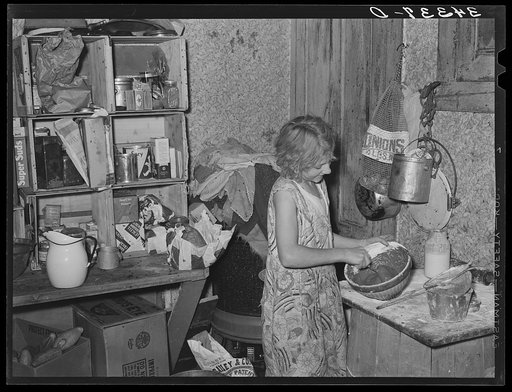 Daughter of FSA (Farm Security Administration) client mixing a cake. Farm near Bradford, Vermont. Orange County