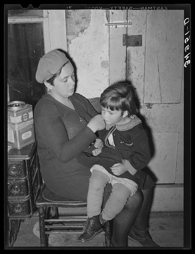 Untitled photo, possibly related to: Wife of FSA (Farm Security Administration) client fixing her daughter's hair. Farm near Bradford, Vermont, Orange County