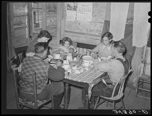Farm family eating dinner. Orange County, Bradford, Vermont