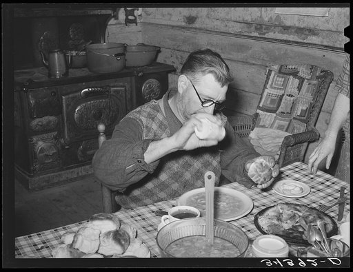 Salting his beans. Farmer in Orange County near Bradford, Vermont