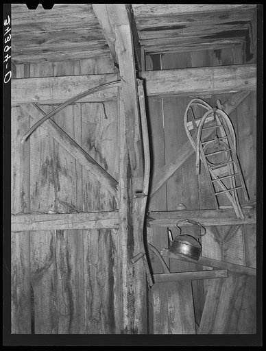 Snowshoes and scythe in barn in Orange County near Bradford, Vermont