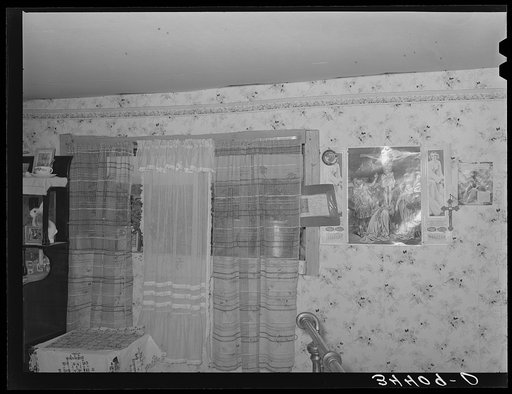 Untitled photo, possibly related to: Sideboard weighed down with photographs in Spanish-American home in Taos County, New Mexico