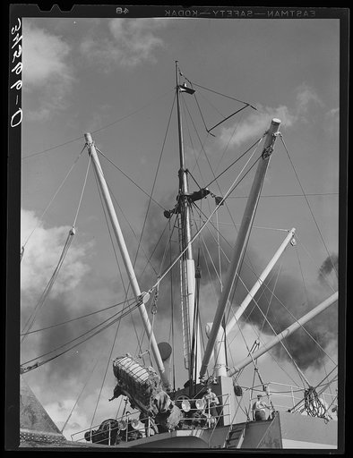 Loading of cotton for export. Notice man operating winch. Port of Houston, Texas