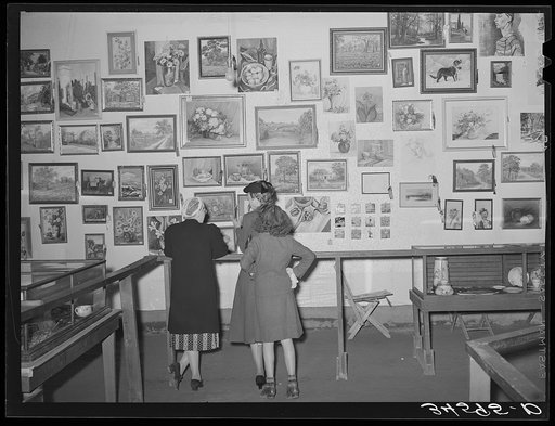 Looking at an art exhibit at the county fair. Gonzales, Texas