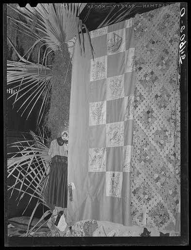 Hand work at Gonzales County Fair, Gonzales Texas. Notice the Bible quilt. This pattern is very popular in all rural sections and is to be seen at every country fair