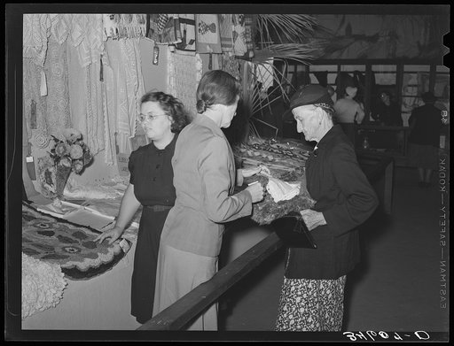 Untitled photo, possibly related to: Women looking at quilting and crocheting exhibit at Gonzales County Fair. Gonzales, Texas