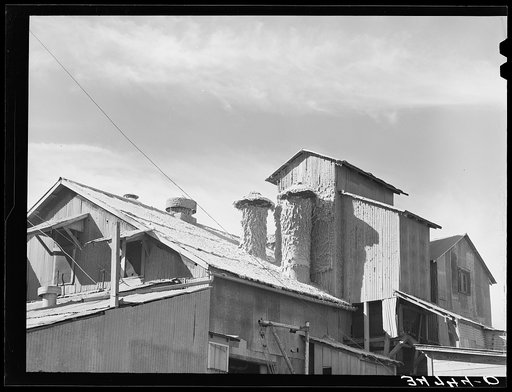 Untitled photo, possibly related to: Cotton gin at the end of the season. Taylor, Texas