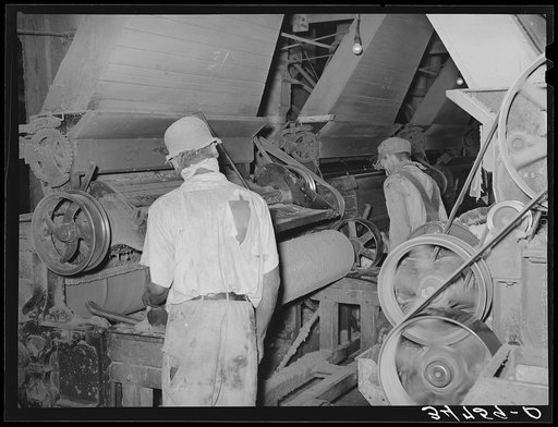 Untitled photo, possibly related to: Negro working on machine in cotton seed oil mill. McLennan County, Texas