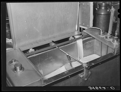 Milk flowing into pasteurizer. Creamery, San Angelo, Texas
