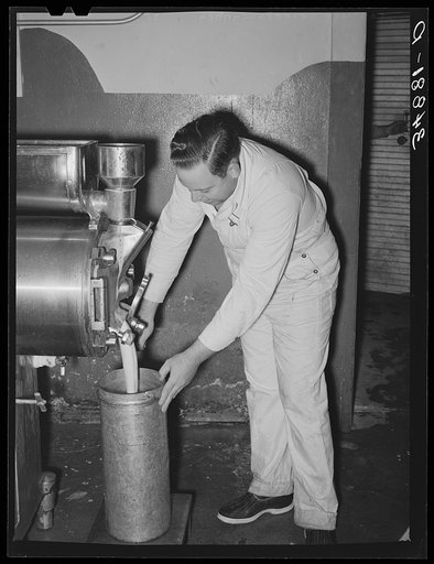 Untitled photo, possibly related to: Filling can with ice cream mix. Creamery, San Angelo, Texas. Later it will be placed in freezer