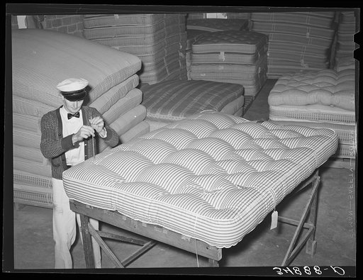 Piercing a mattress in tufting. Mattress factory. San Angelo, Texas