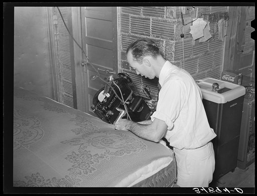 Sewing cover of mattress. Mattress factory. San Angelo, Texas