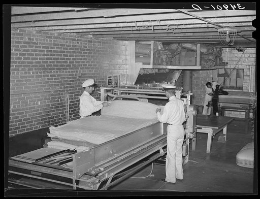 Forming cotton bats which will fill mattress. Mattress factory. San Angelo, Texas