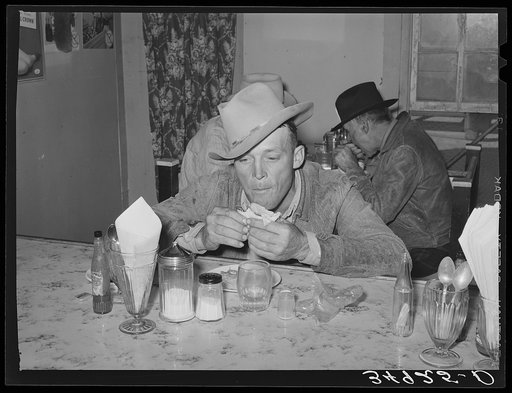 West Texan at eating house at auction. Stockyards, San Angelo, Texas