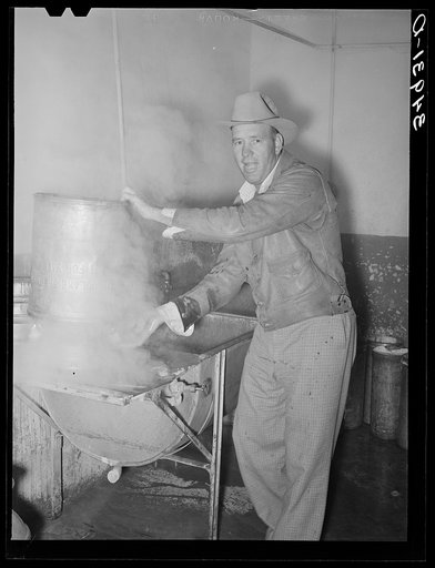 Farmer steaming his milk cans before taking them home. Creamery, San Angelo, Texas