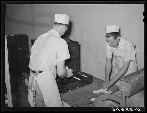 Preparing rolls for baking. Bakery, San Angelo, Texas