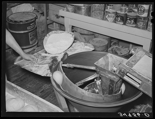 Centrifugal machine for forming dough into shape for rolls. Bakery, San Angelo, Texas