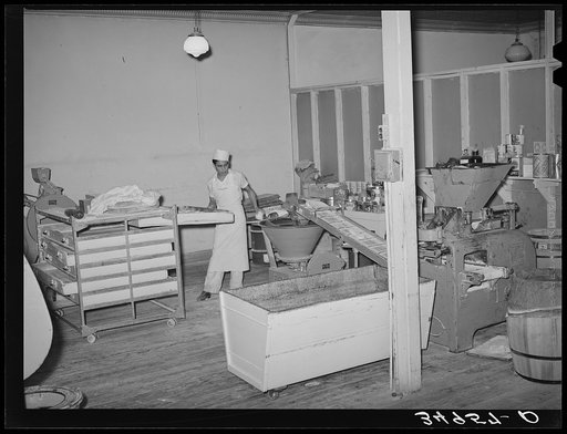 Corner of bakery with machine which forms dough into rolls. Bakery, San Angelo, Texas