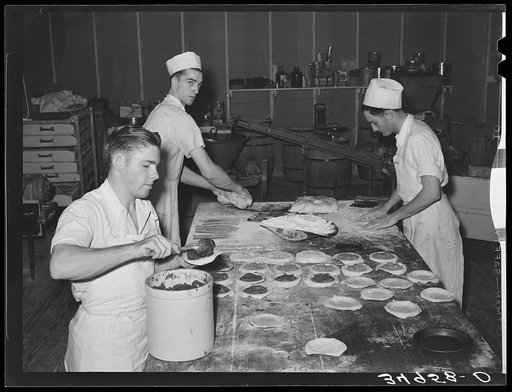Making pies. Rolling crusts and filling them at bakery at San Angelo, Texas