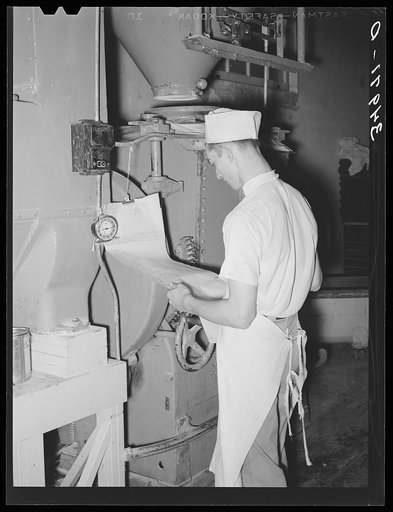 Looking over the order list for baking. Bakery, San Angelo, Texas