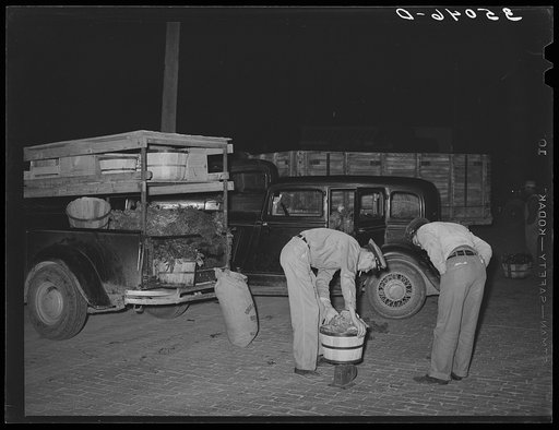 Weighing vegetables. Early morning farmers' market, San Angelo, Texas