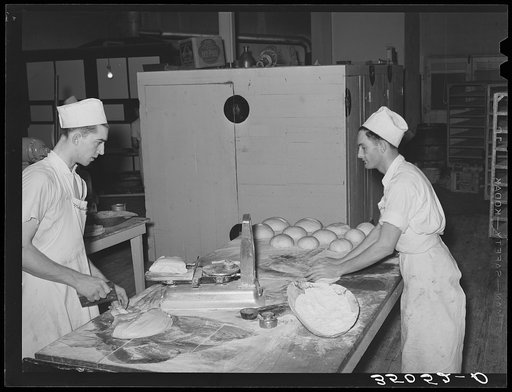 Cutting, weighing and shaping dough into loaves. Bakery, San Angelo, Texas