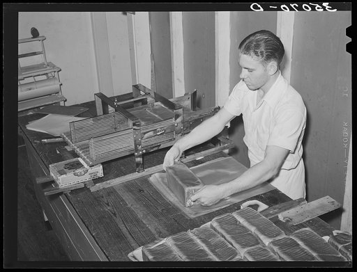 Wrapping bread at bakery. San Angelo, Texas