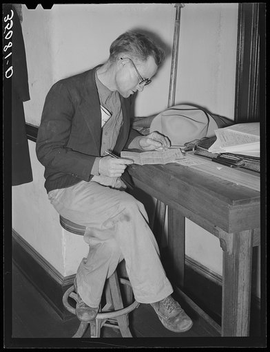 FSA (Farm Security Administration) client making out farm and home plan. Mason, Texas