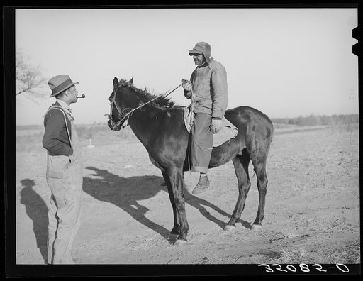 Pomp Hall, Negro tenant farmer, talking to a neighbor who has ridden up on horseback. Creek County, Oklahoma. See general caption number 23