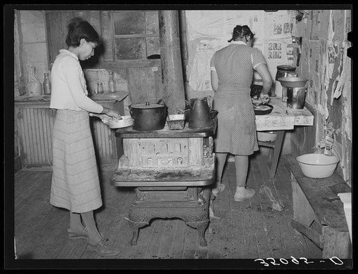 Wife and daughter of Pomp Hall, Negro tenant farmer, preparing supper. Creek County, Oklahoma. See general caption number 23