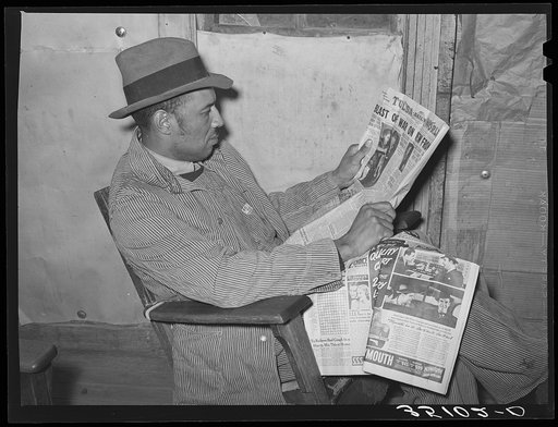 Pomp Hall, Negro tenant farmer, reading newspaper to which he subscribes. Creek County, Oklahoma. See general caption number 23