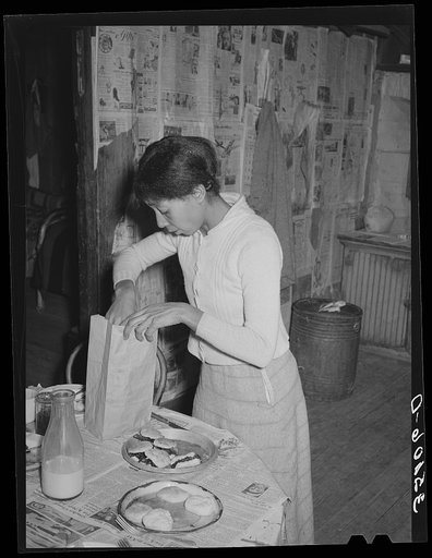 Wife of Pomp Hall, Negro tenant farmer, preparing lunch for her children to take to school. Creek County, Oklahoma. See general caption number 23