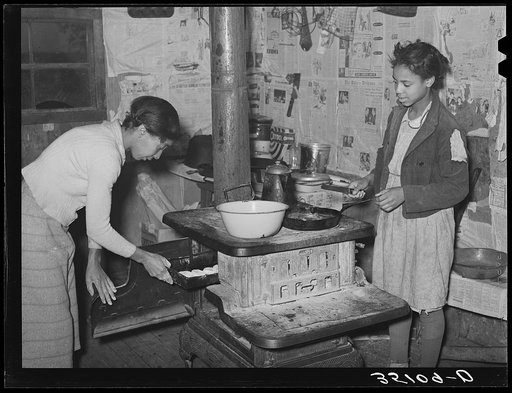 Preparing breakfast in home of Pomp Hall, Negro tenant farmer. Creek County, Oklahoma. See general caption number 23