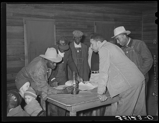 Conference of officials of local chapter of UCAPAWA (United Cannery, Agricutural, Packing, and Allied Workers) of America in Tabor, Creek County, Oklahoma. Pomp Hall, who is leaning on table at right, is an active leader in the union and in his community among both whites and Negroes. See general ca