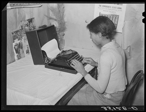 Wife of Pomp Hall, Negro tenant farmer, writing on typewriter. Through union activities this family has developed a desire for higher education. This typewriter is to them a symbol of that education and as such is the most prized family possession. Creek County, Oklahoma. See general caption no. 23