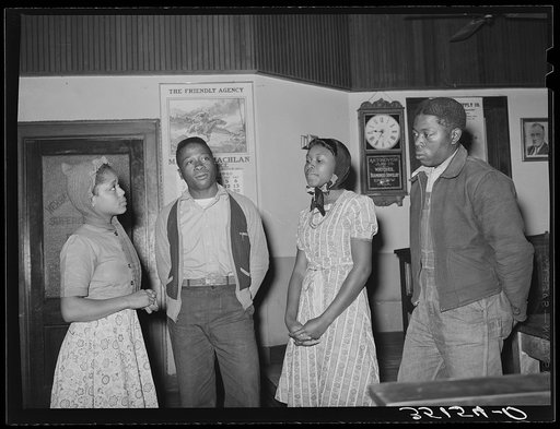 Negro boys and girls humming spiritual at UCPAPWA (United Cannery, Agricultural, Packing, and Allied Workers of America) meeting, Bristow, Oklahoma. The union meeting has become a main social gathering in these sections and has taken on some of the spirit of the old time revival. Spirituals vie with