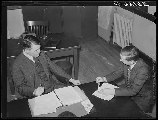 FSA (Farm Security Administration) supervisor, left, UCAPAWA (United Cannery, Agricultural, Packing, and Allied Workers of America) state representation, right, discussing means of helping tenant farmers and sharecroppers in Oklahoma. Sapulpa, Oklahoma