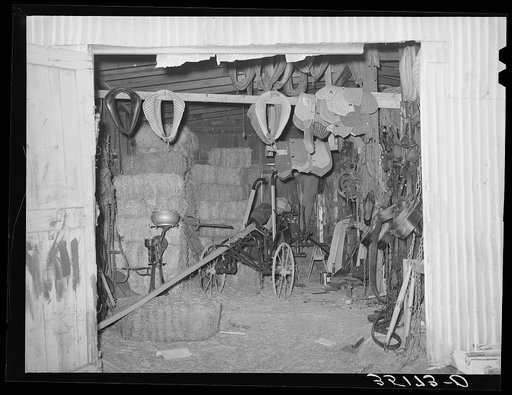 Scene in feed mill and secondhand farm equipment shop. Oklahoma City, Oklahoma