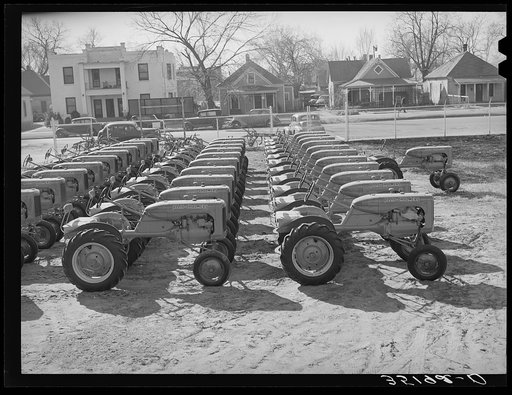 Untitled photo, possibly related to: Tractors at farm equipment warehouse. Oklahoma City, Oklahoma