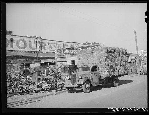 Truckload of feed in front of farm implement store. Oklahoma City, Oklahoma