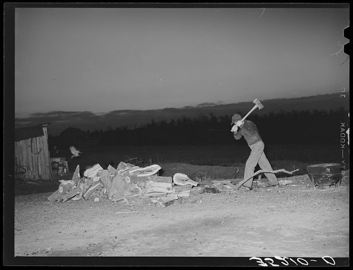 Son of Pomp Hall chopping wood in the early dawn. Creek County, Oklahoma. See general caption number 23