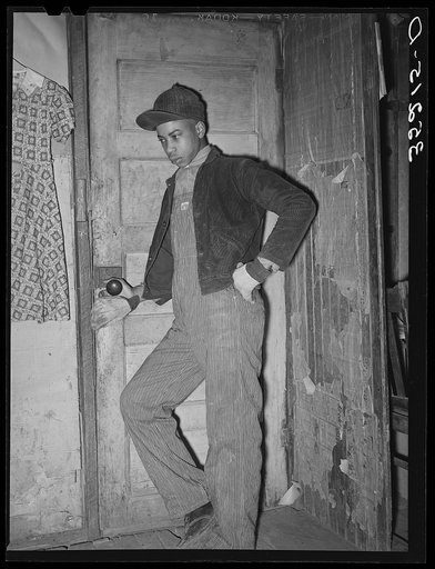Untitled photo, possibly related to: Son of Pomp Hall, Negro tenant farmer, coming through doorway in his house. Creek County, Oklahoma. See general caption number 23