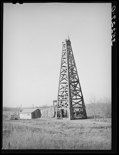 Old wooden derrick. Well now on pump. Creek County, Oklahoma