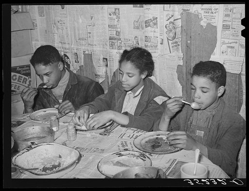 Children of Pomp Hall, Negro tenant farmer, eating their supper. For supper the family had corn bread, peas, gravy, rice, fried bacon and turnips. See general caption number 23. Creek County, Oklahoma