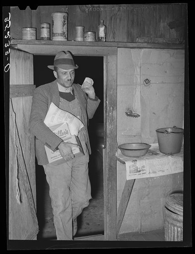 Pomp Hall, Negro tenant farmer, coming in the kitchen door carrying seed and groceries which he bought in Tulsa. Creek County, Oklahoma. See general caption number 23