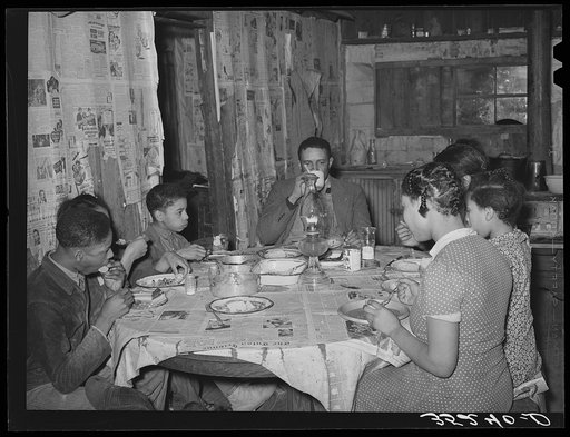 Pomp Hall, his wife, and five children eating supper. Creek County, Oklahoma. See general caption number 23