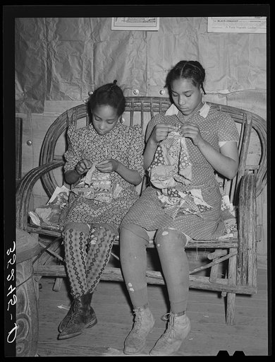 Two daughters of Pomp Hall, Negro tenant farmer, making patchwork cushions for chairs. Creek County, Oklahoma. See general caption number 23