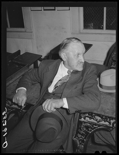 Farmer waiting for pie supper to start. Muskogee County, Oklahoma. See general caption number 24