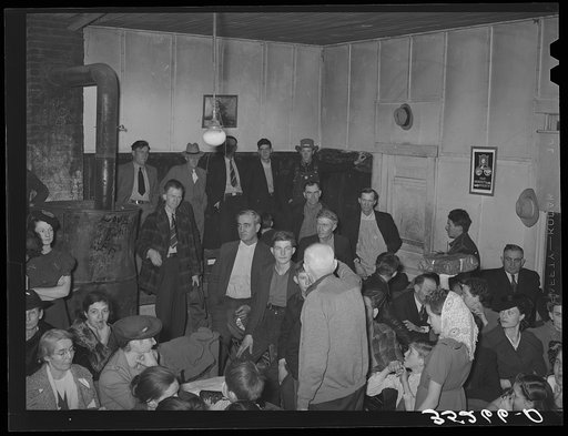 Auctioning off the pies at pie supper in the school house. Muskogee County, Oklahoma. See general caption number 24
